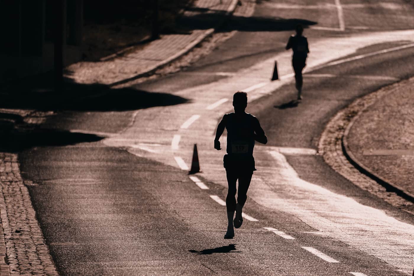 A runner on a track at sunrise