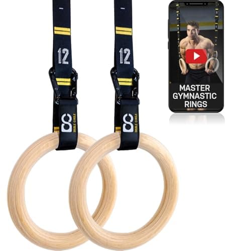 A man training on gymnastic rings indoors